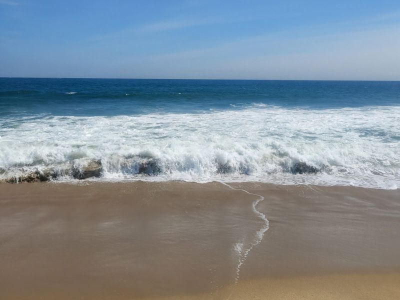 Waves crashing onto a beach